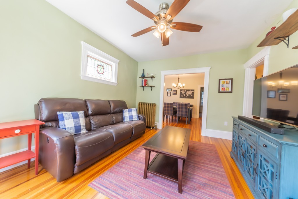 16 Parkton Road, Unit A Boston, MA 02130 - Photo 11 of 31 a living room with furniture and a flat screen tv