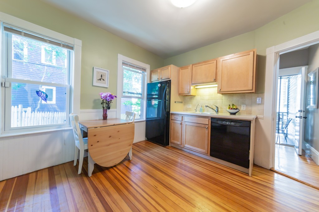 16 Parkton Road, Unit A Boston, MA 02130 - Photo 13 of 31 a kitchen with granite countertop a refrigerator stove top oven and sink