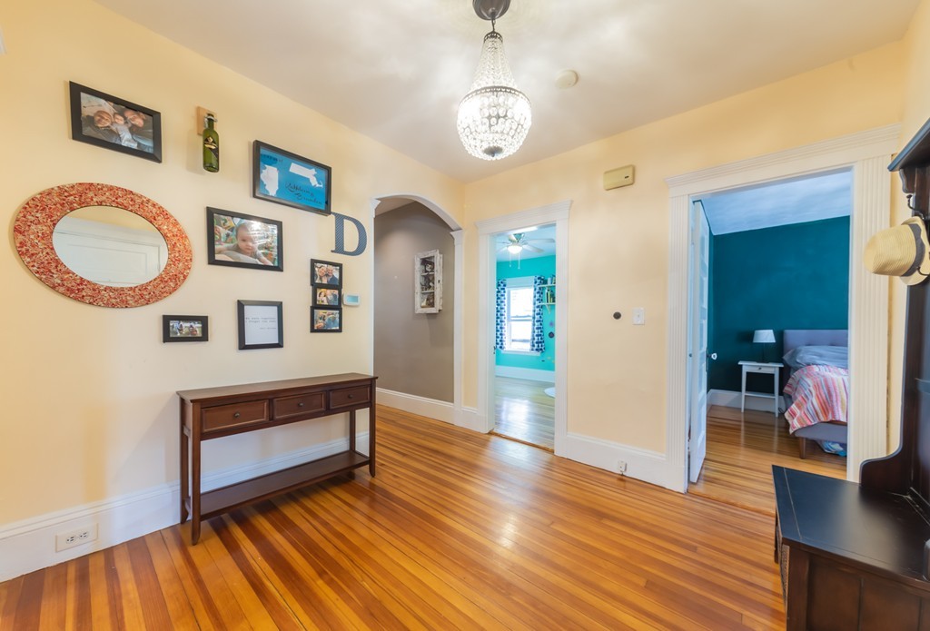16 Parkton Road, Unit A Boston, MA 02130 - Photo 3 of 31 a living room with furniture and a wooden floor