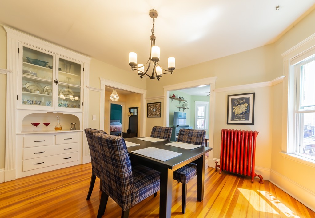 16 Parkton Road, Unit A Boston, MA 02130 - Photo 5 of 31 a view of a dining room with furniture and wooden floor