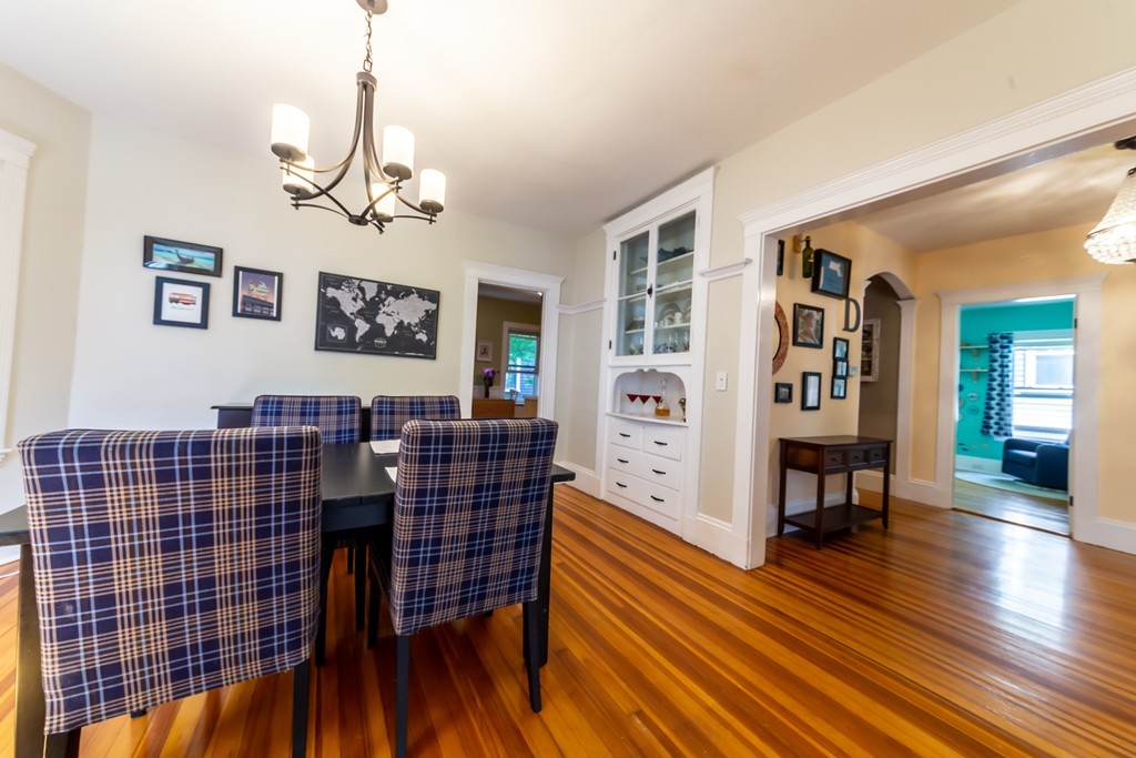 16 Parkton Road, Unit A Boston, MA 02130 - Photo 6 of 31 a view of a livingroom and dining room with wooden floor