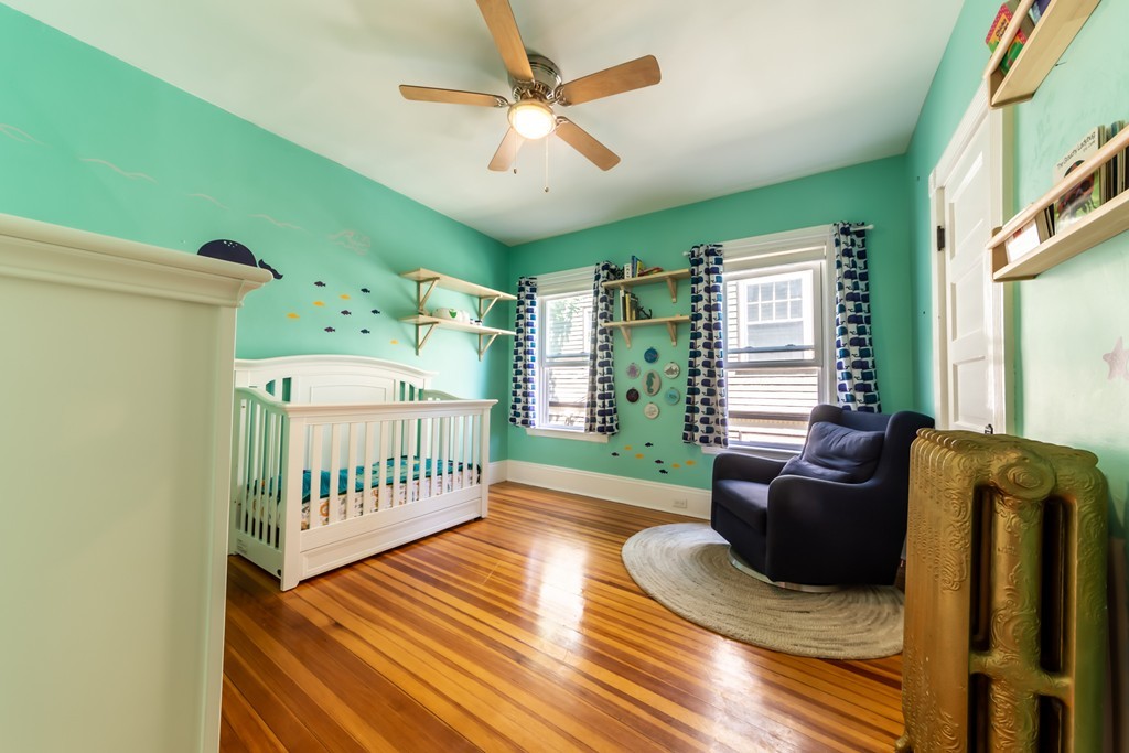 16 Parkton Road, Unit A Boston, MA 02130 - Photo 8 of 31 a bedroom with furniture and a window