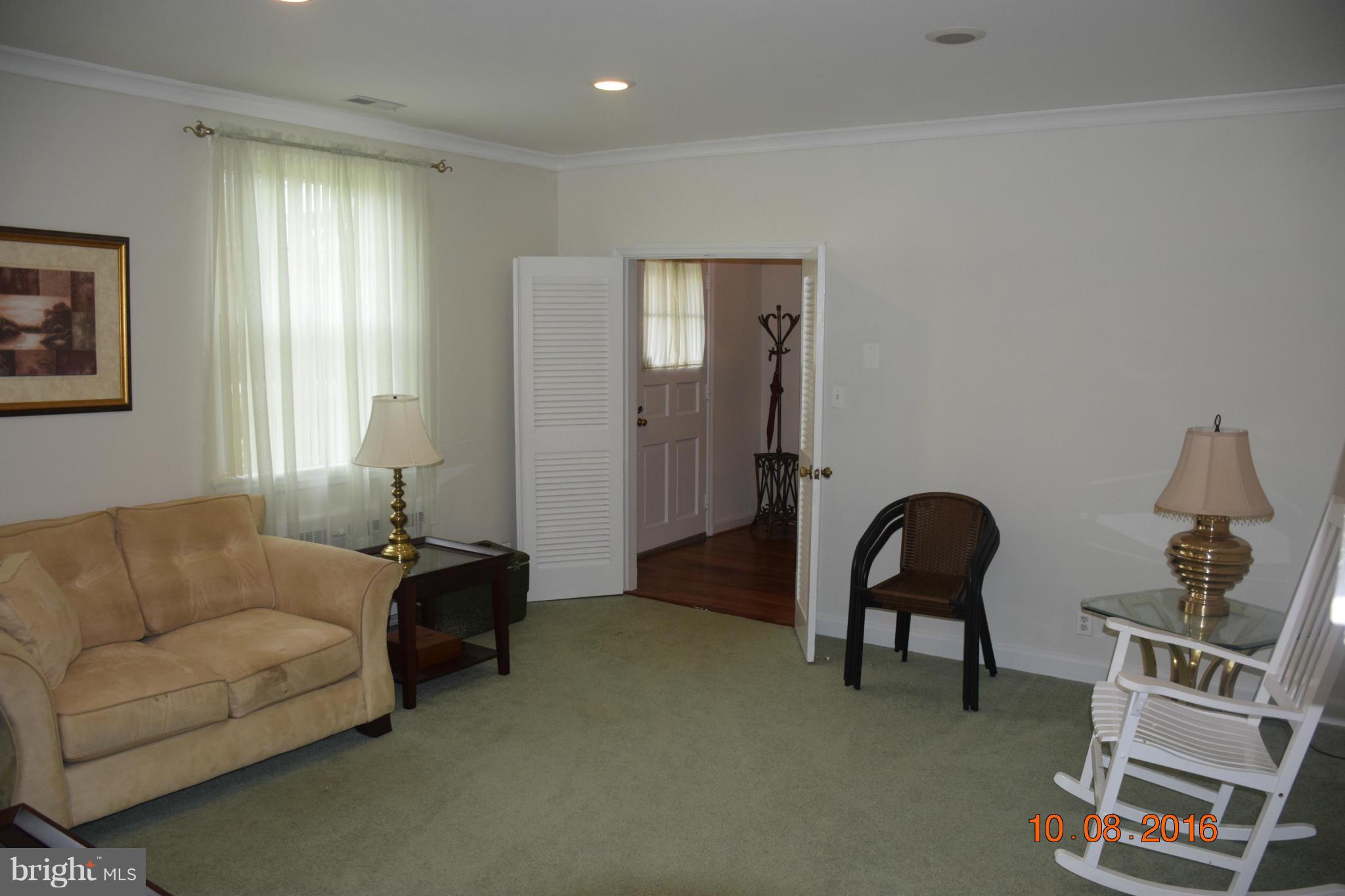 6810 Campfield Road Baltimore, MD 21207 - Photo 14 of 30 a living room with furniture and a window