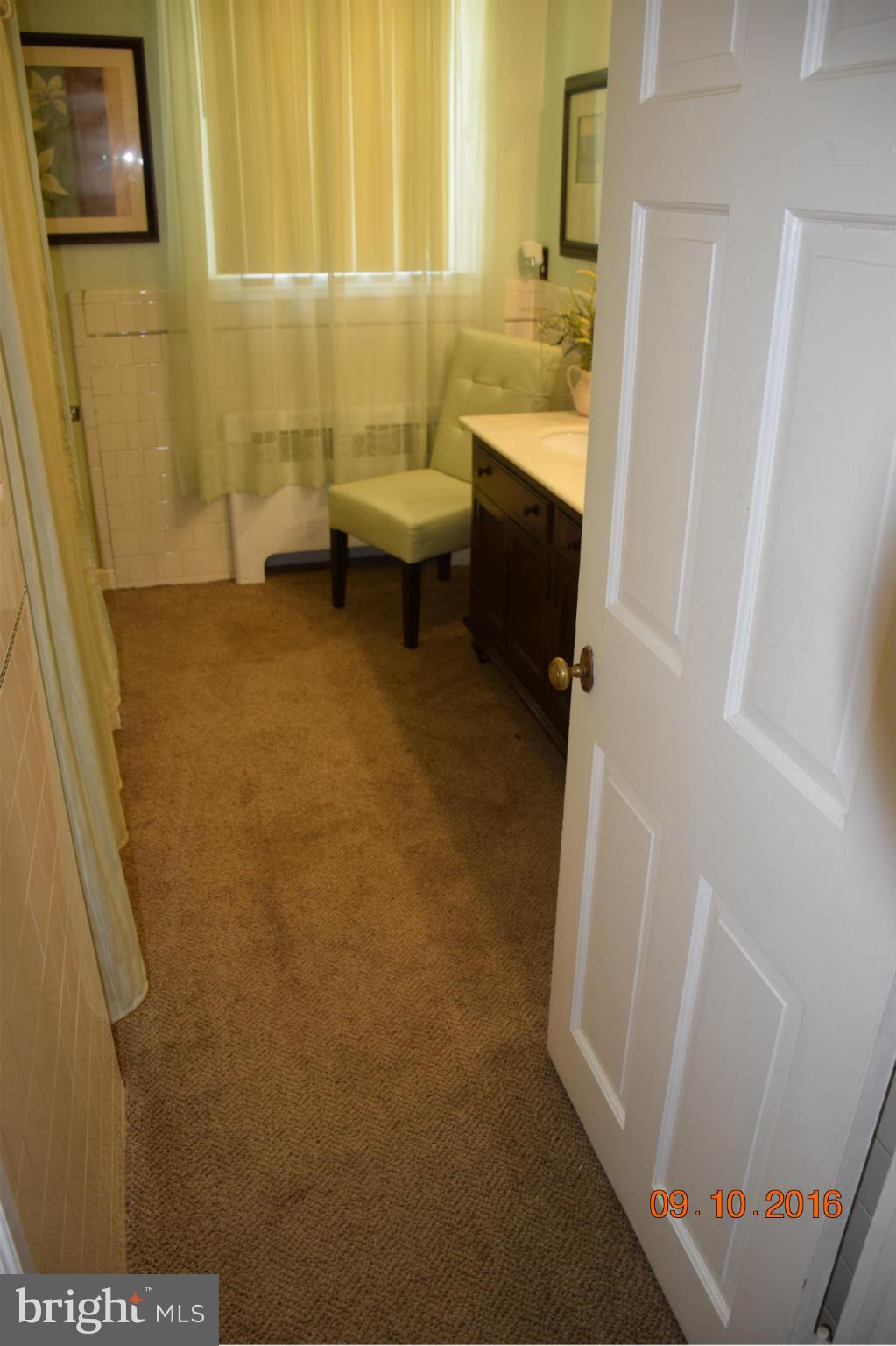 6810 Campfield Road Baltimore, MD 21207 - Photo 19 of 30 a bathroom with a sink and a tub