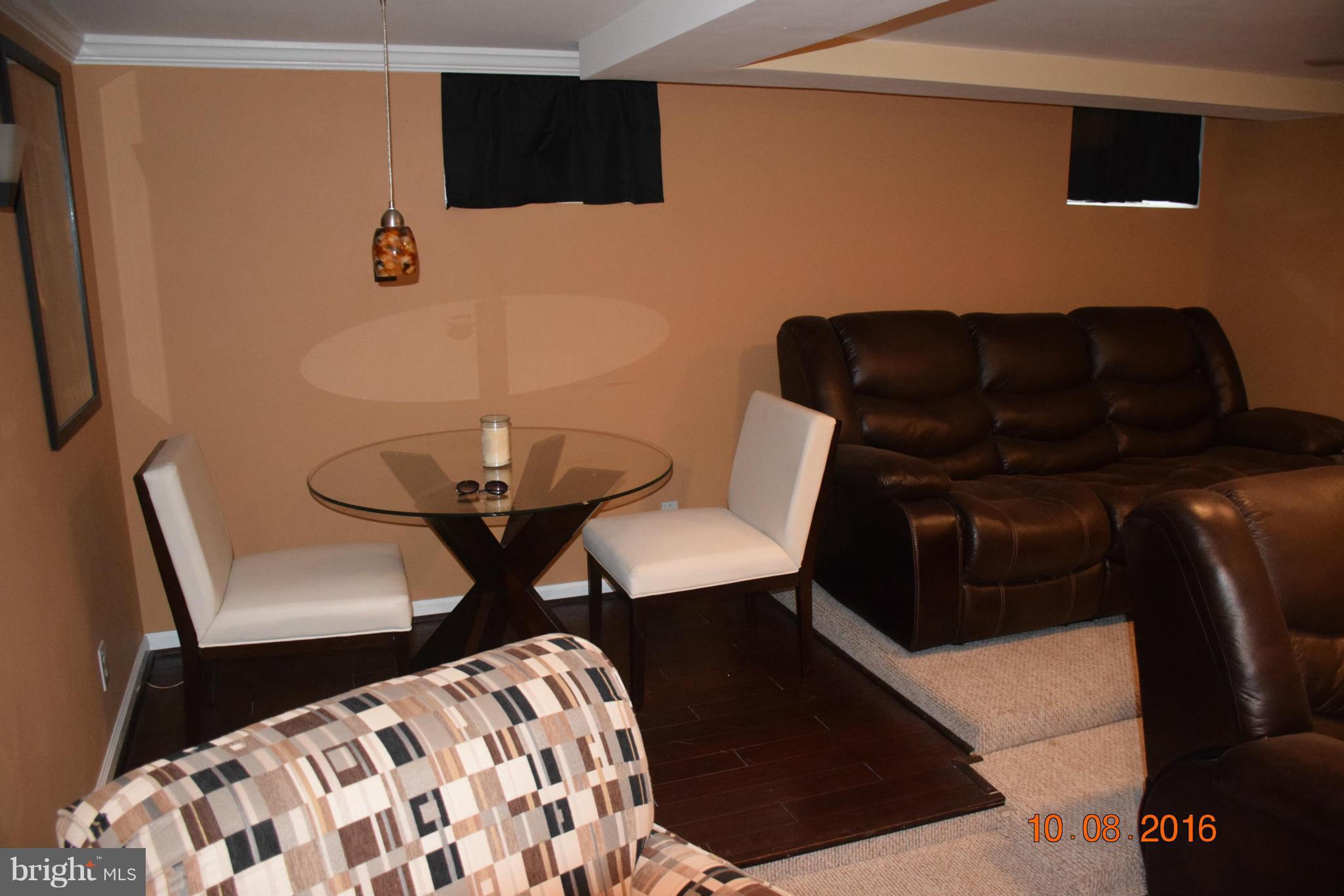 6810 Campfield Road Baltimore, MD 21207 - Photo 22 of 30 a black leather chair in a living room