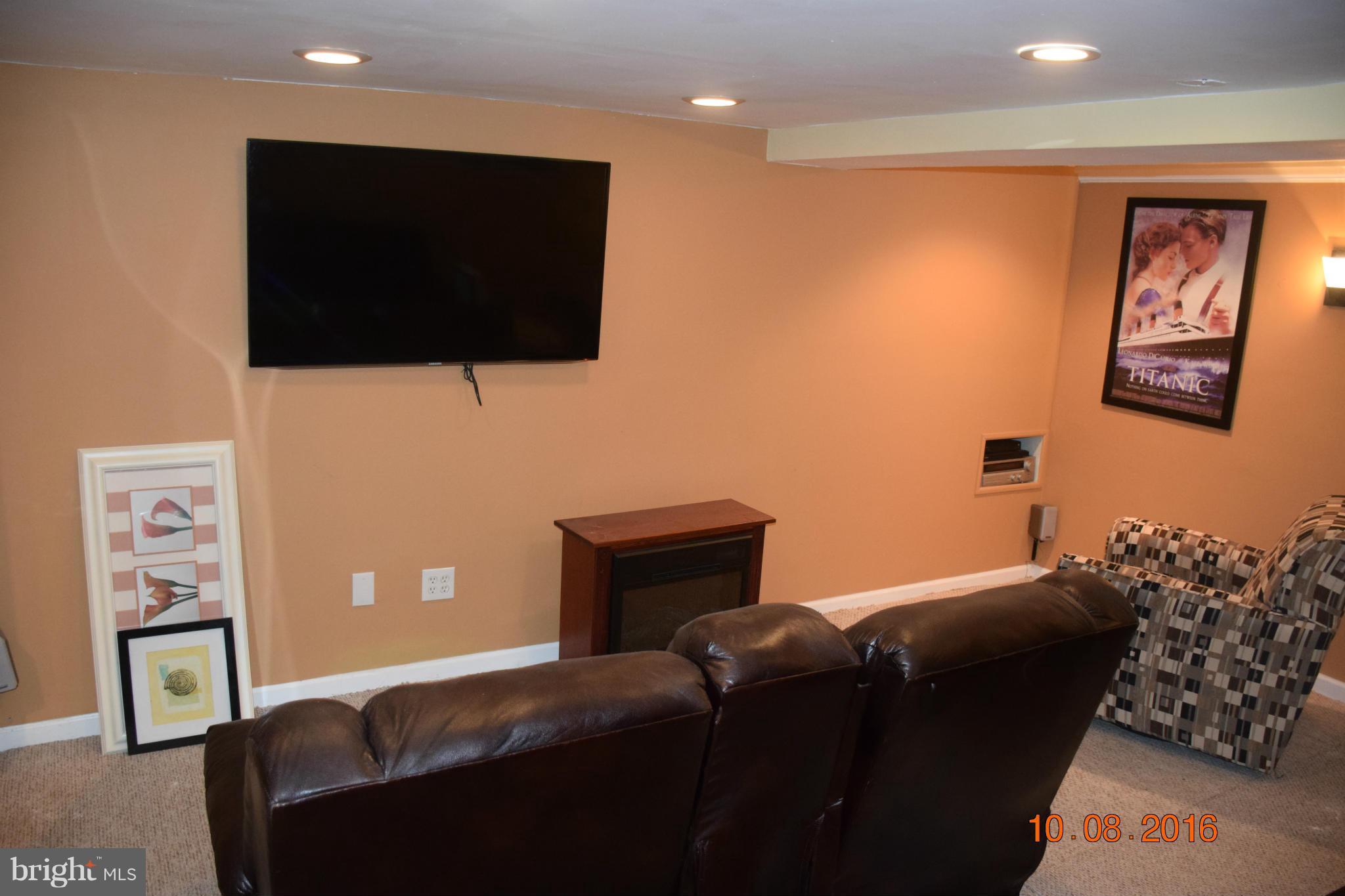 6810 Campfield Road Baltimore, MD 21207 - Photo 23 of 30 a bedroom with a bed and a flat screen tv