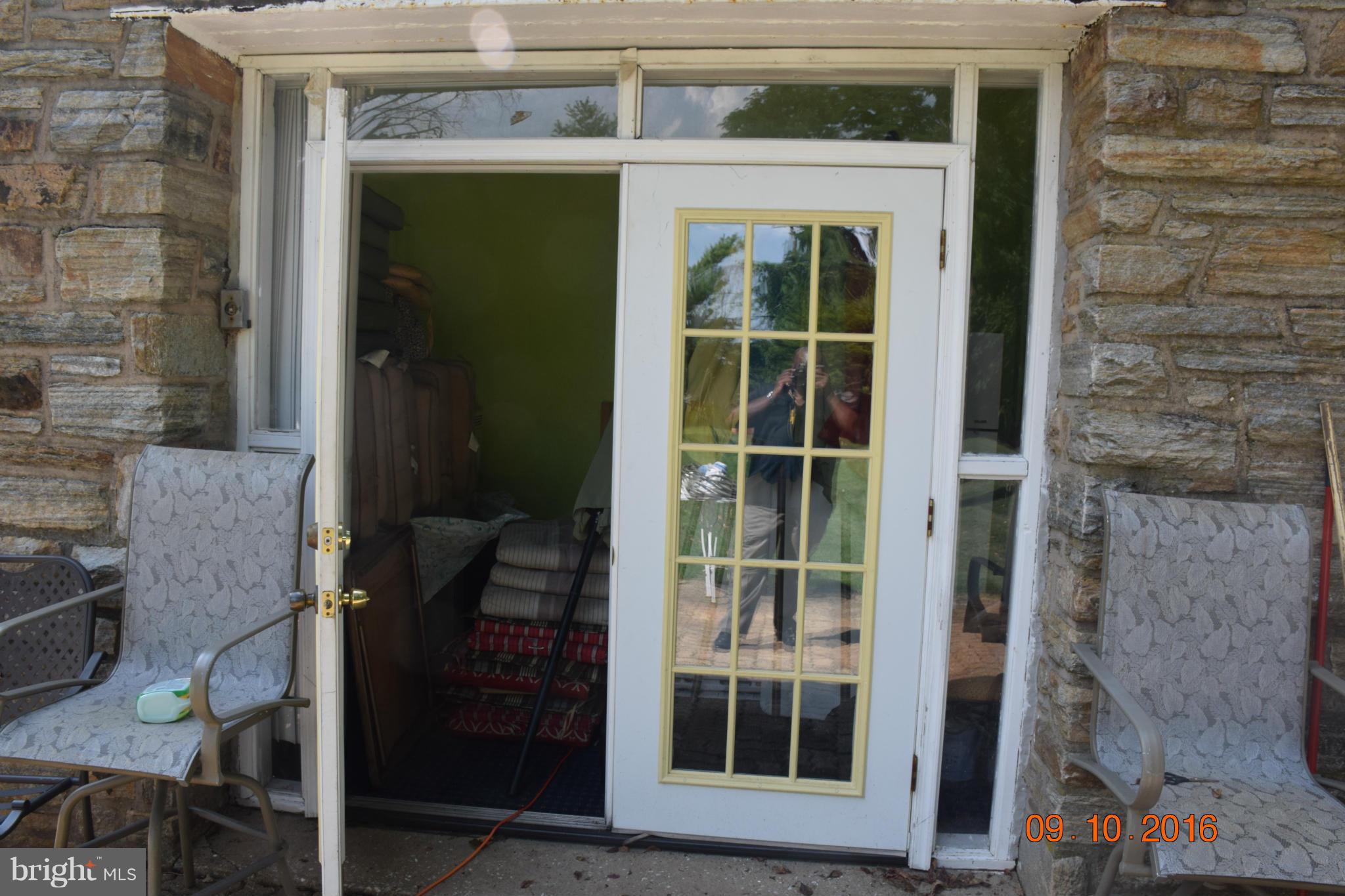 6810 Campfield Road Baltimore, MD 21207 - Photo 25 of 30 a view of front door and windows