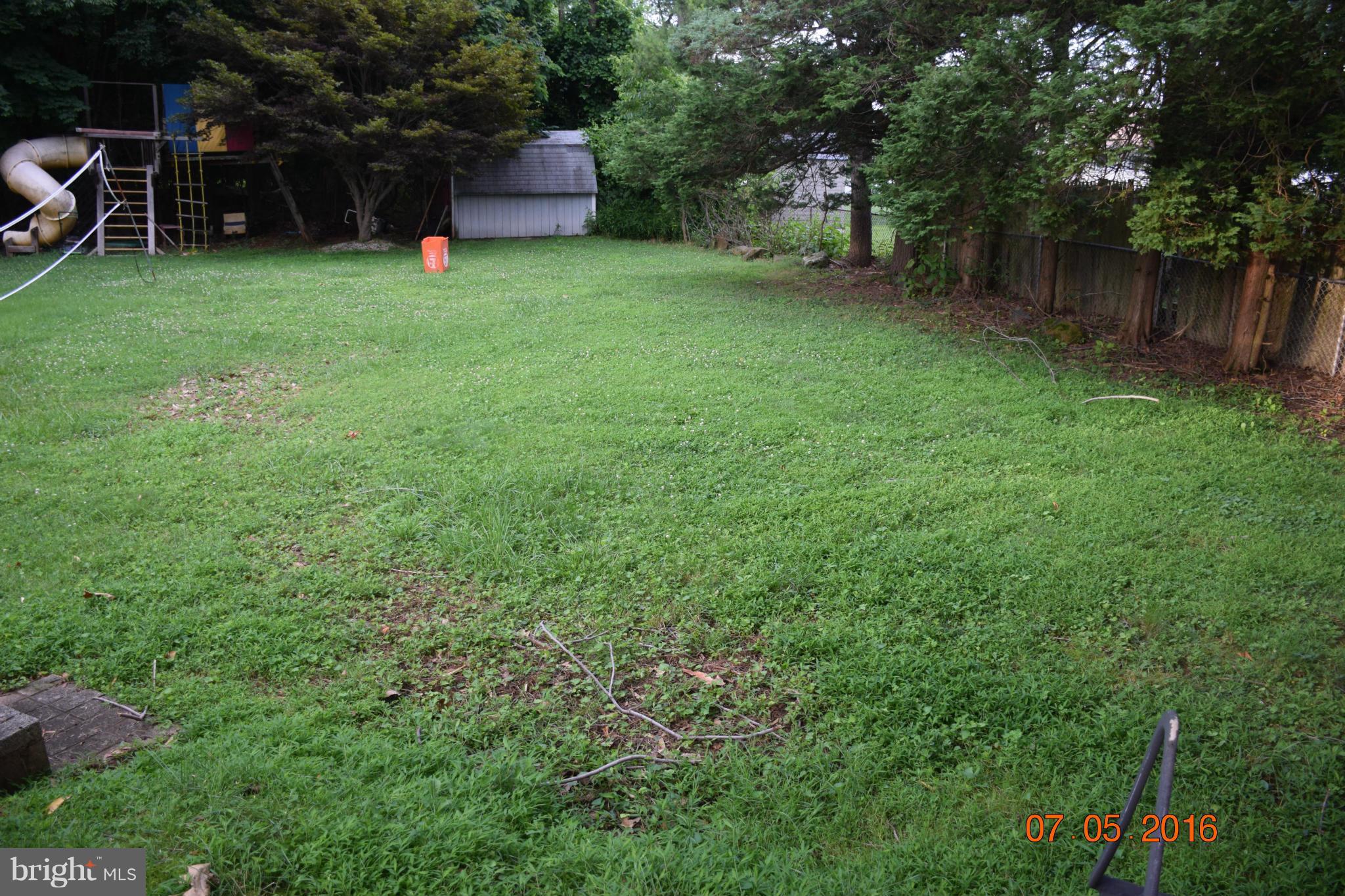 6810 Campfield Road Baltimore, MD 21207 - Photo 27 of 30 a view of a backyard with a sitting area