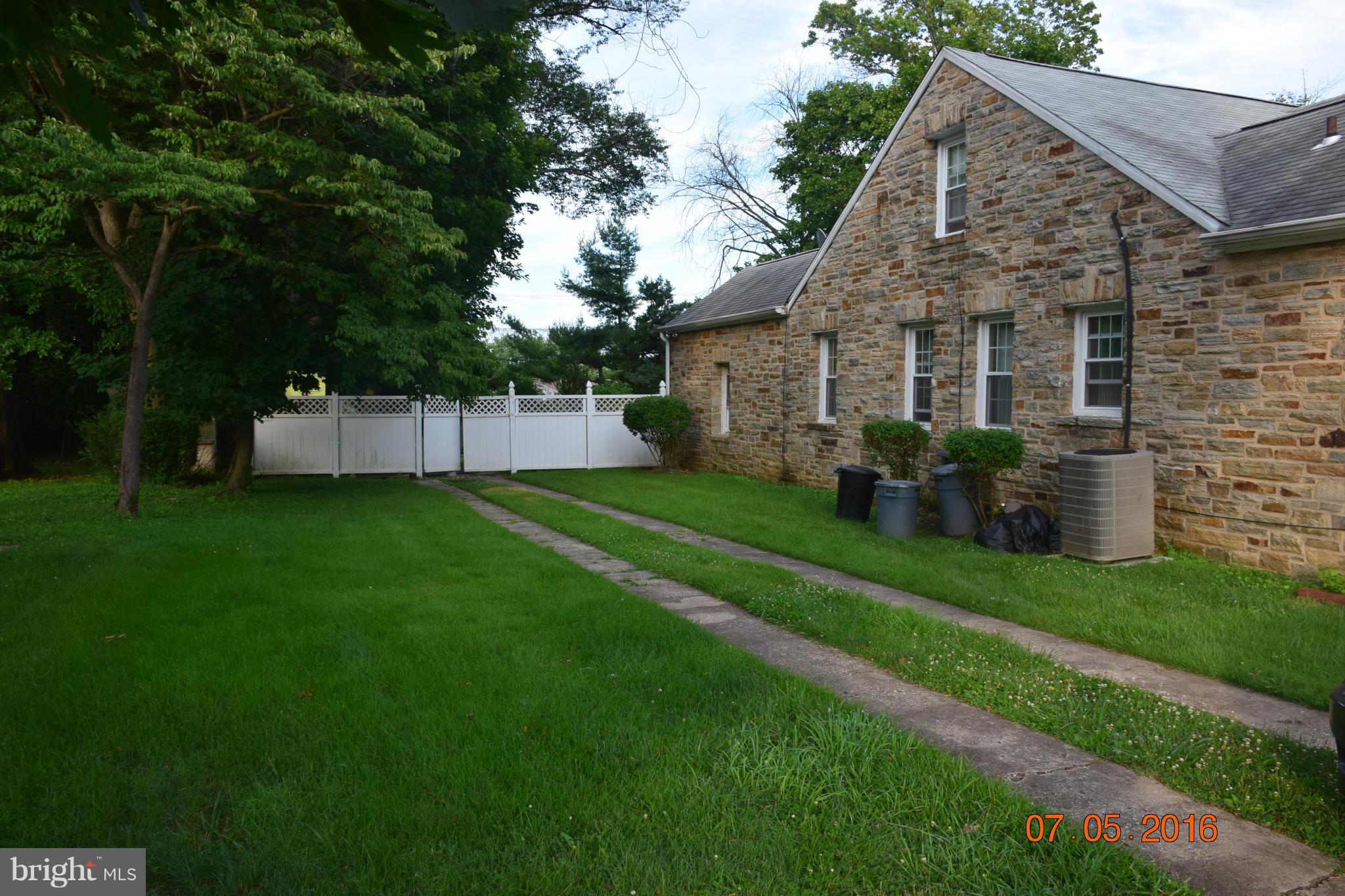 6810 Campfield Road Baltimore, MD 21207 - Photo 4 of 30 a view of a house with backyard and garden