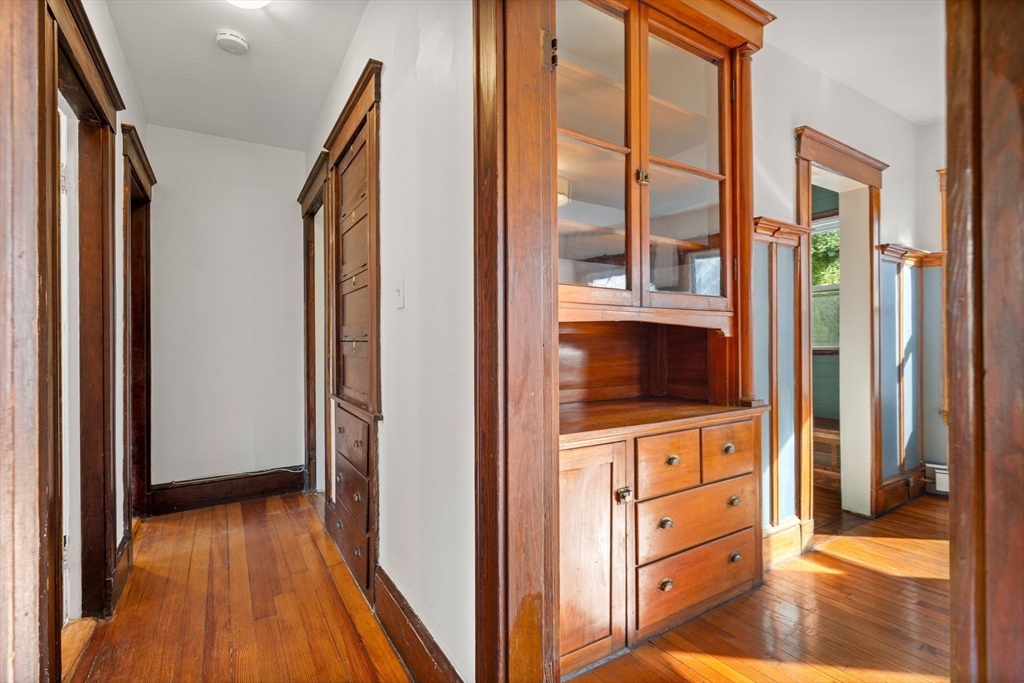 23 Brayton Road, Unit 23 Boston, MA 02135 - Photo 11 of 39 a view of walk in closet with wooden floor
