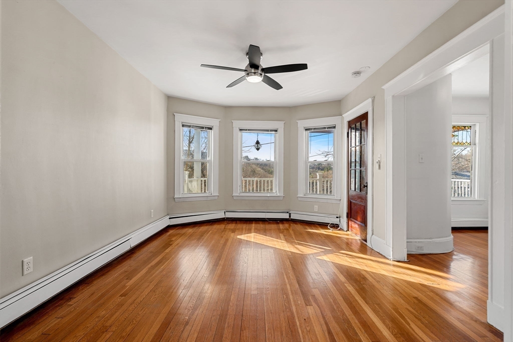 23 Brayton Road, Unit 23 Boston, MA 02135 - Photo 17 of 39 a view of empty room with wooden floor and fan