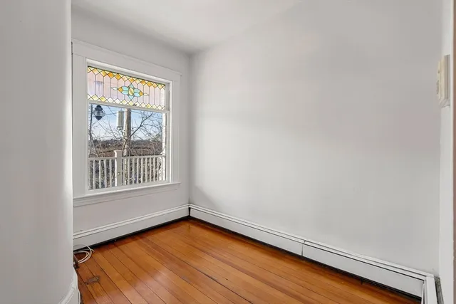 a view of a brick house with wooden floor