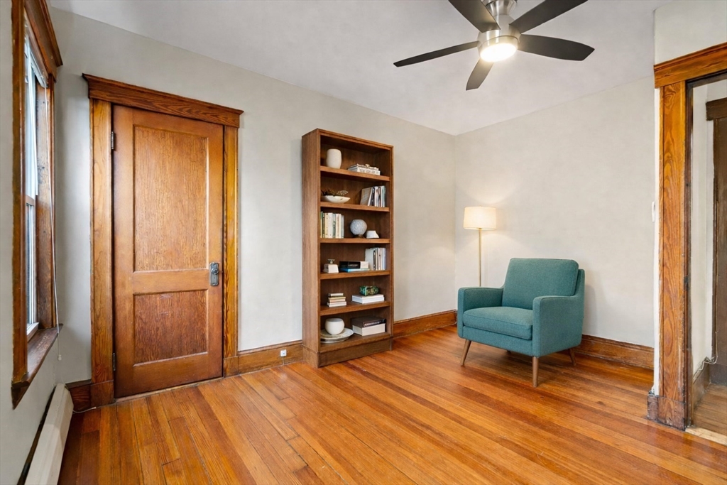 23 Brayton Road, Unit 23 Boston, MA 02135 - Photo 21 of 39 a bedroom with a bed and a chair