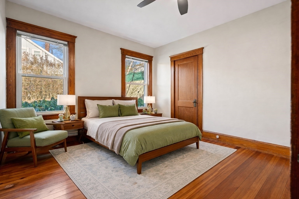 23 Brayton Road, Unit 23 Boston, MA 02135 - Photo 26 of 39 a bedroom with a bed and wooden floor