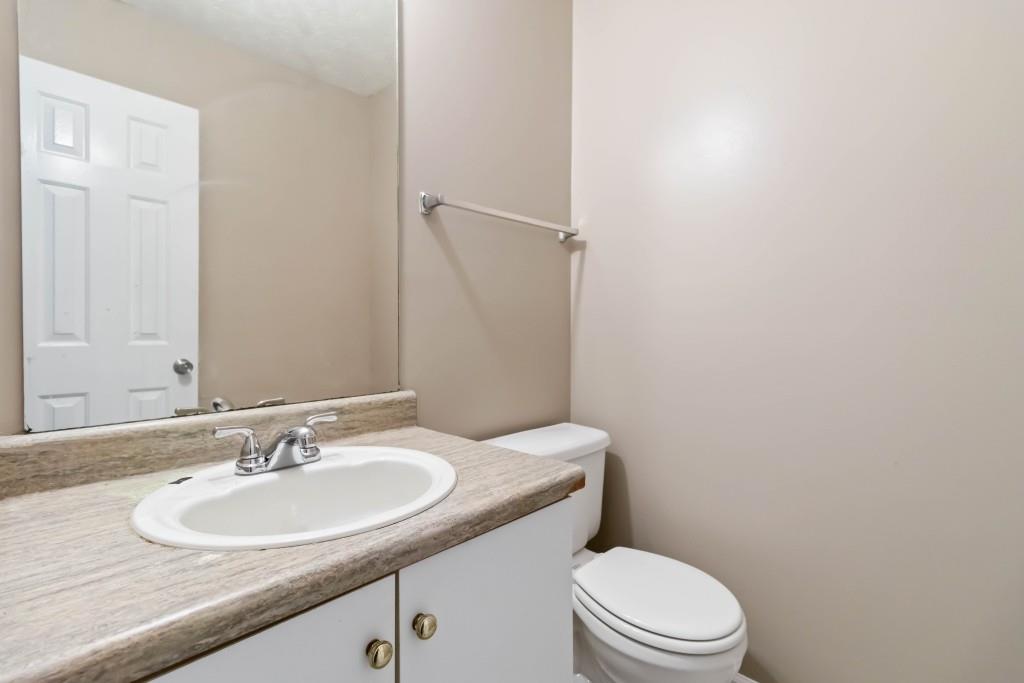 4783 Creekside Place Decatur, GA 30035 - Photo 13 of 24 a bathroom with a sink toilet and a mirror