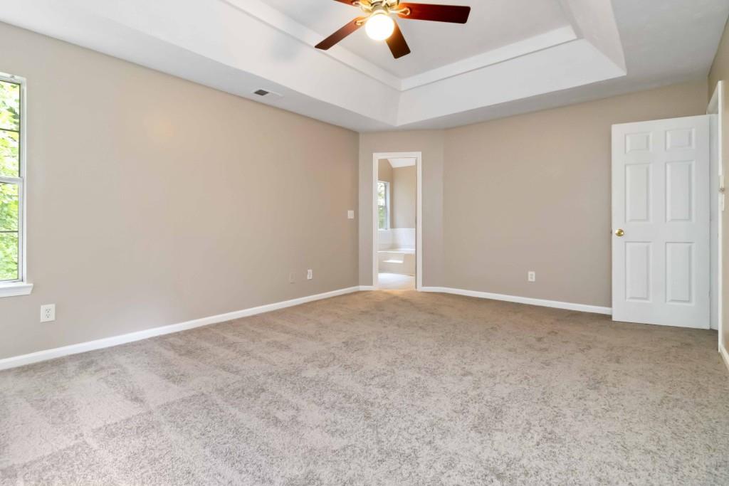 4783 Creekside Place Decatur, GA 30035 - Photo 16 of 24 an empty room with a ceiling fan and window