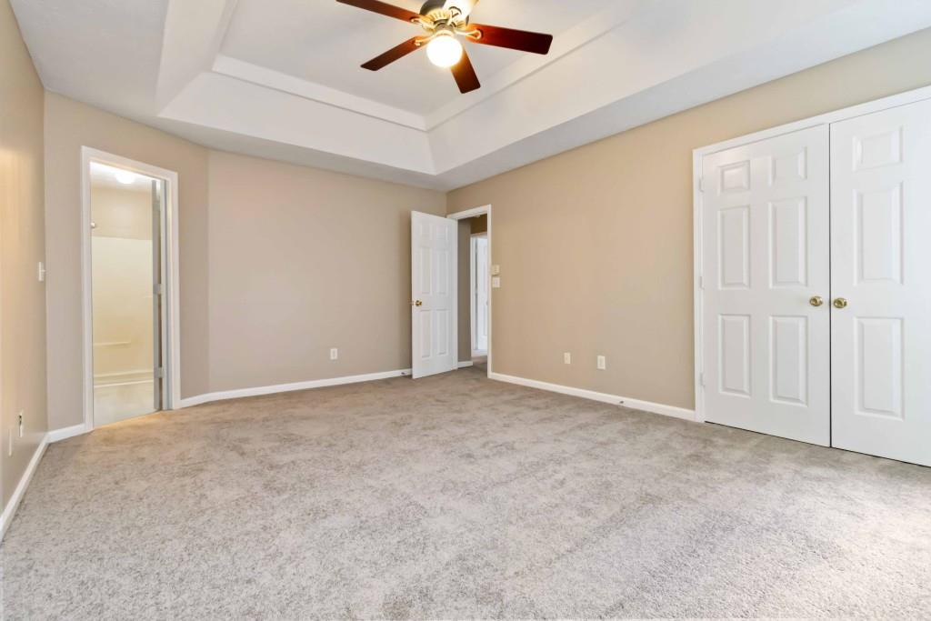 4783 Creekside Place Decatur, GA 30035 - Photo 17 of 24 an empty room with ceiling fan and window