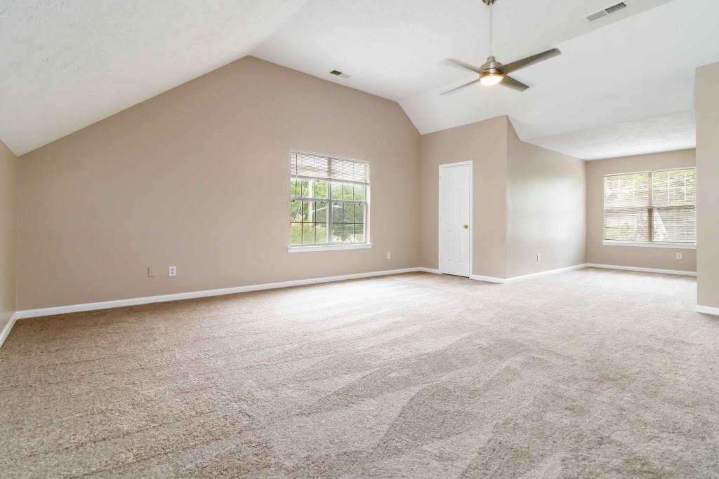 4783 Creekside Place Decatur, GA 30035 - Photo 20 of 24 an empty room with windows and fan