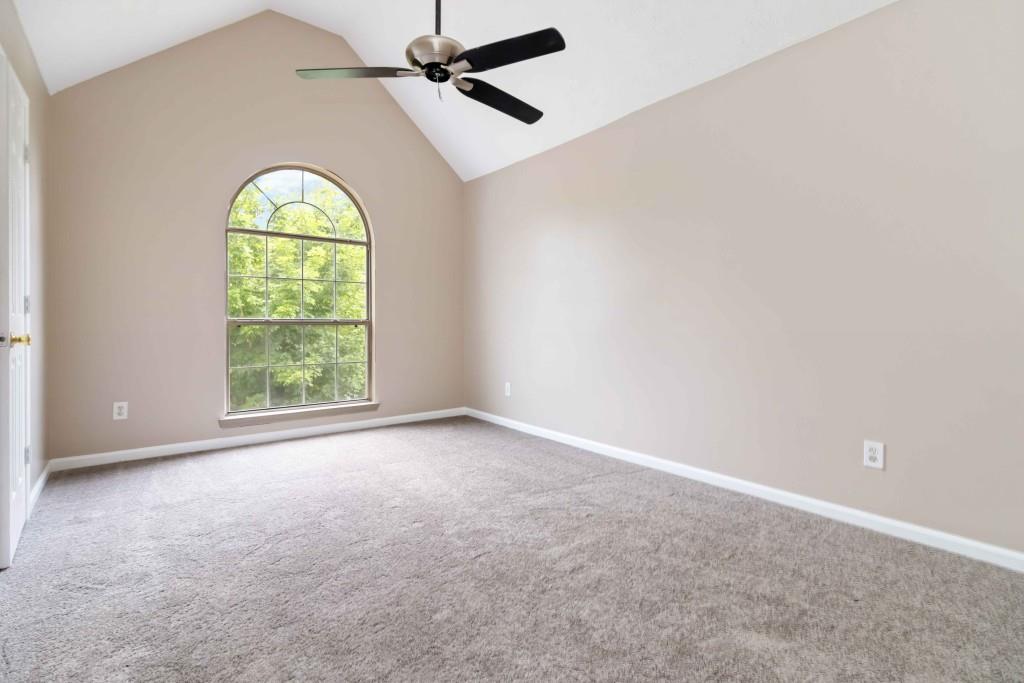 4783 Creekside Place Decatur, GA 30035 - Photo 23 of 24 an empty room with a window and a chandelier