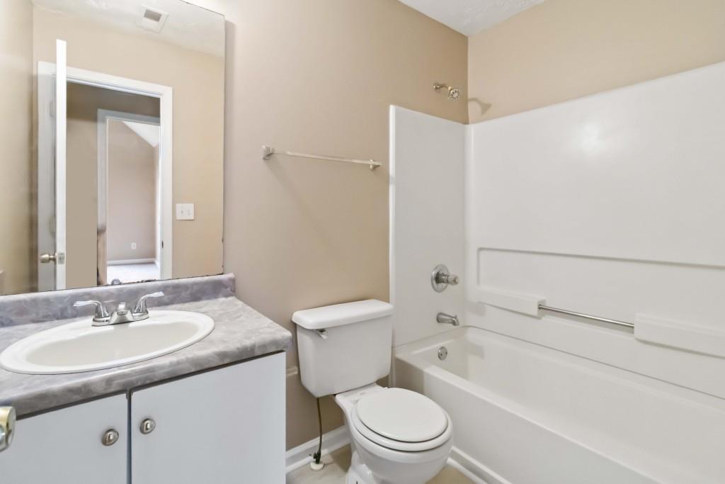 4783 Creekside Place Decatur, GA 30035 - Photo 24 of 24 a bathroom with a granite countertop sink toilet and shower