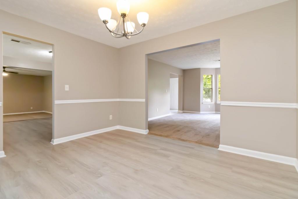 4783 Creekside Place Decatur, GA 30035 - Photo 9 of 24 wooden floor in an empty room with a window
