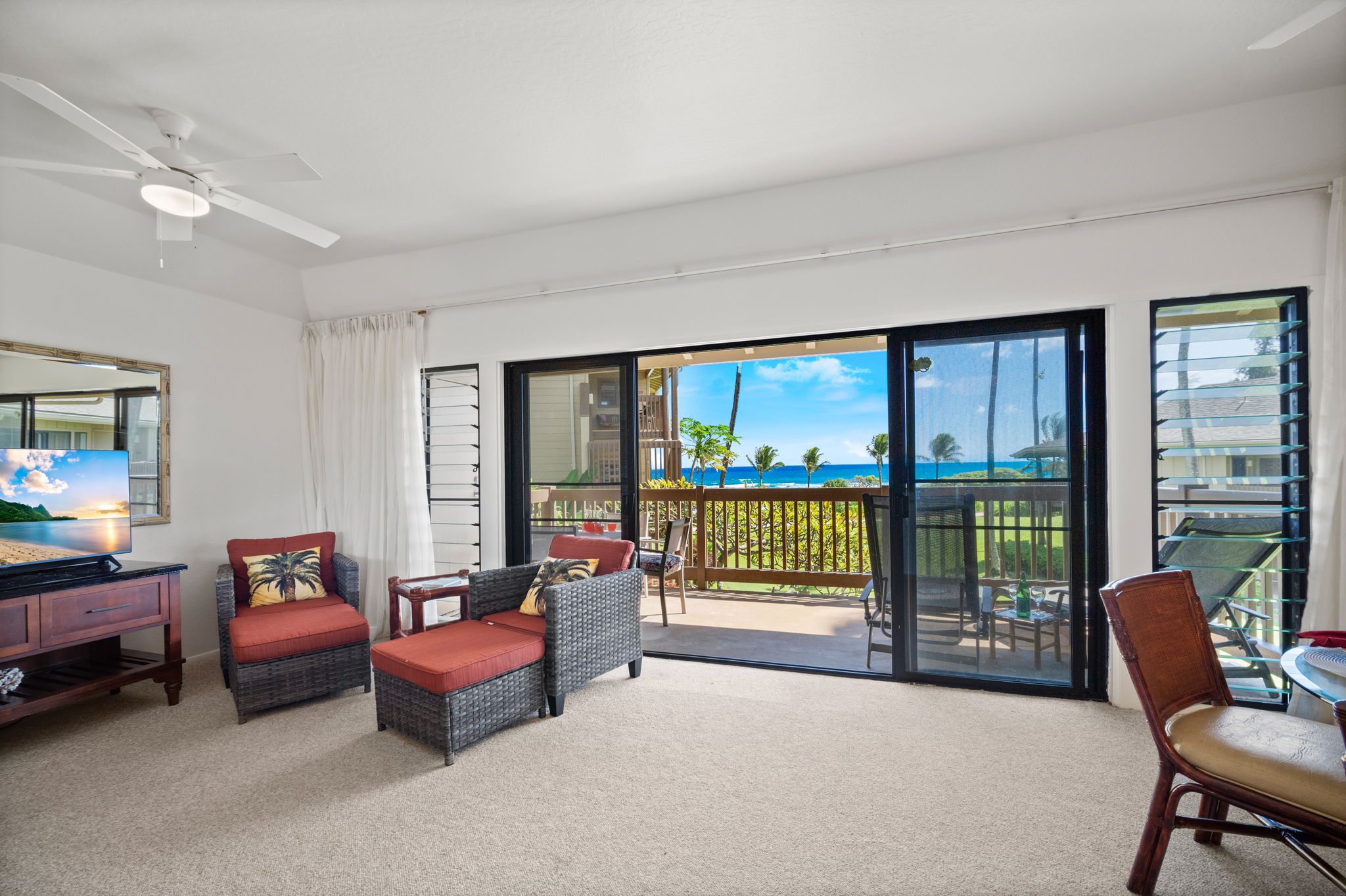4460 Nehe Road, Unit 215 Lihue, HI 96766 - Photo 3 of 25 a living room with furniture and a floor to ceiling window