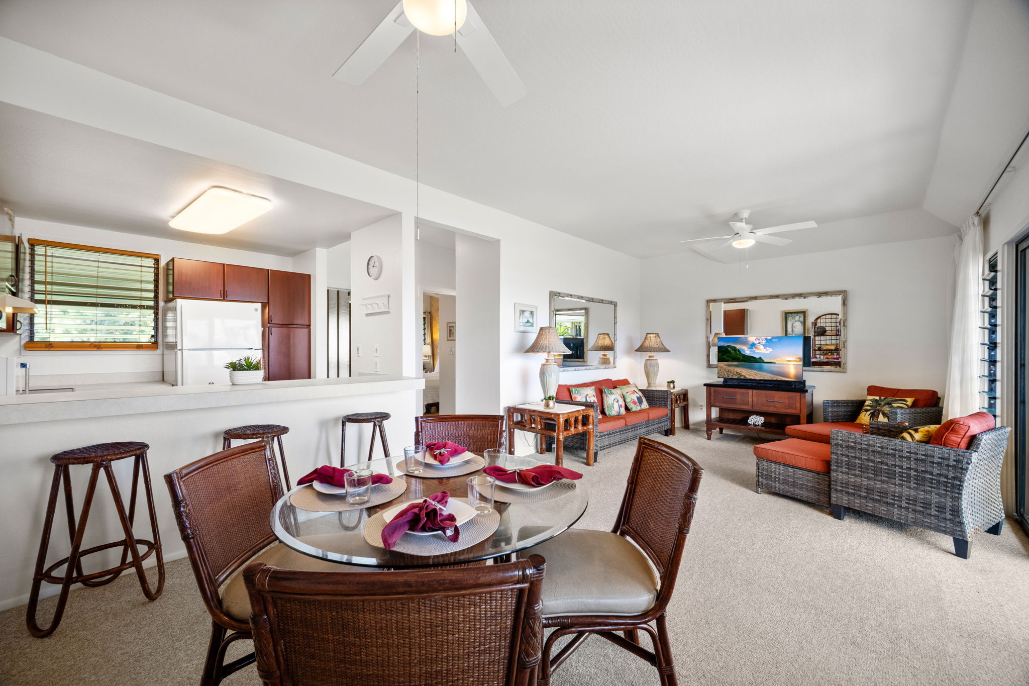 4460 Nehe Road, Unit 215 Lihue, HI 96766 - Photo 6 of 25 a living room with furniture and a flat screen tv