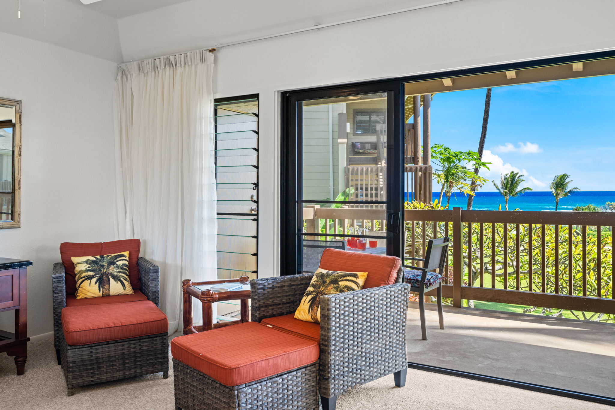 4460 Nehe Road, Unit 215 Lihue, HI 96766 - Photo 10 of 25 a living room with furniture and a floor to ceiling window