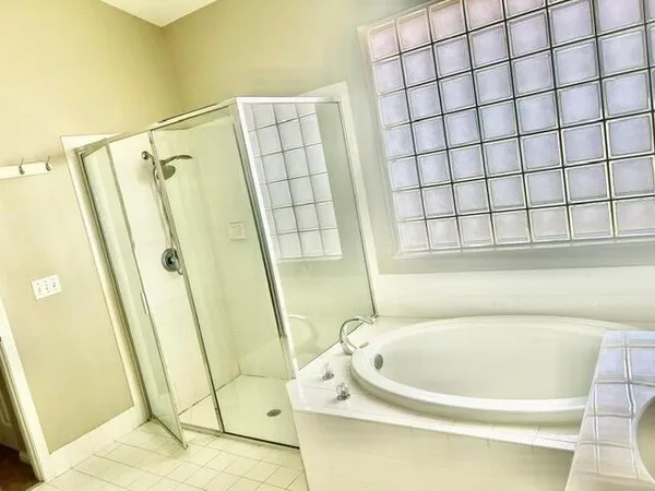 a view of a bathroom from a corridor