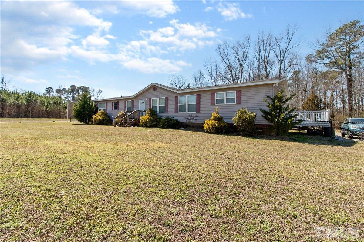 915 Abattoir Road Coats, NC 27521 - Photo 3 of 27 a view of a house with a yard