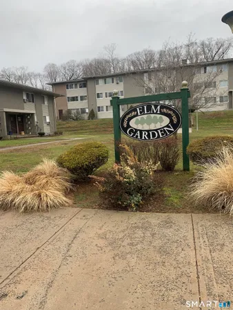 a view of a water fountain and a big yard