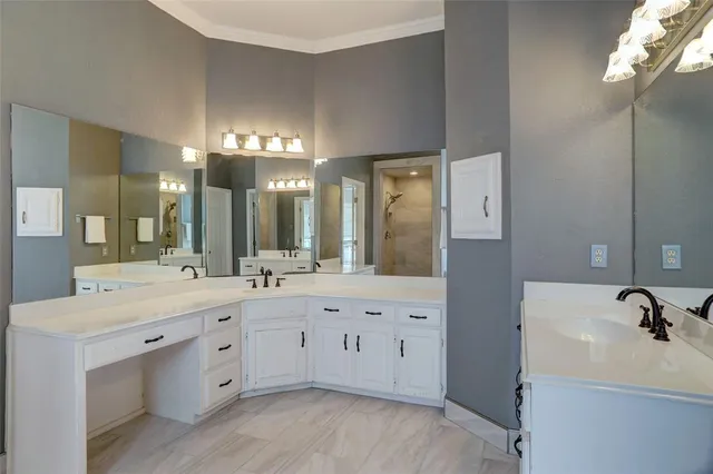 a bathroom with a sink double vanity and a mirror
