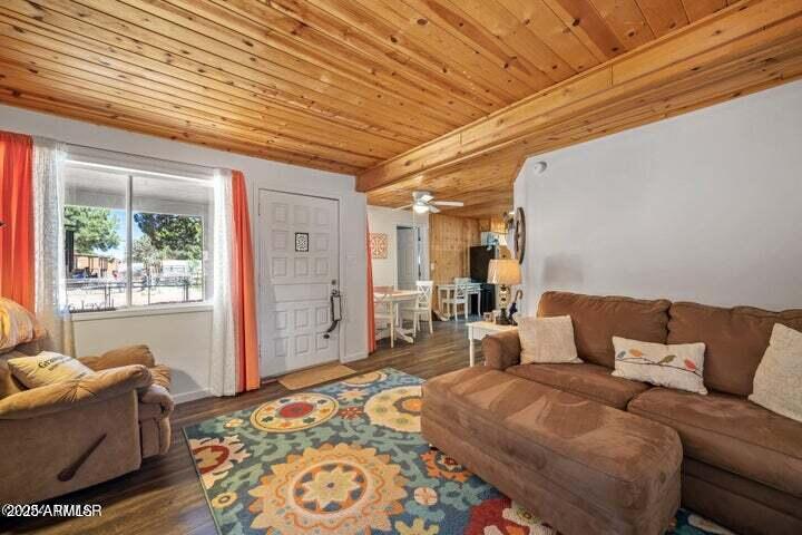 3355 Little Pine Drive Overgaard, AZ 85933 - Photo 12 of 26 a bedroom with furniture and a rug