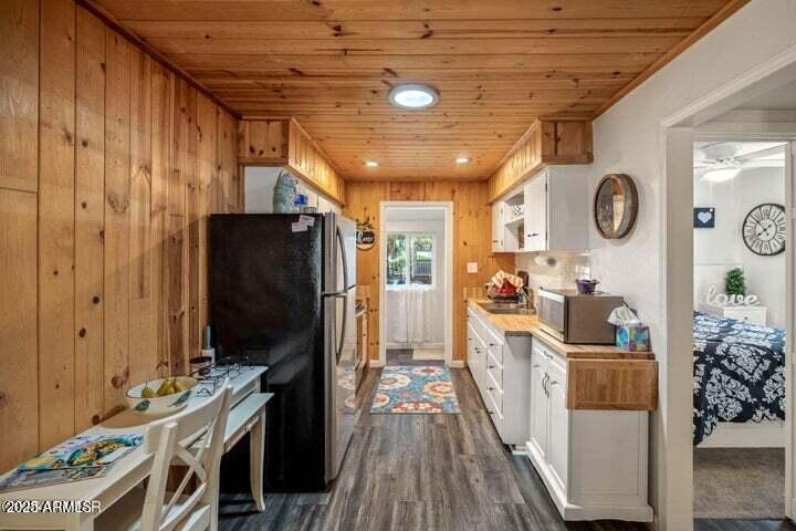 3355 Little Pine Drive Overgaard, AZ 85933 - Photo 14 of 26 a view of a kitchen with fridge and wooden floor