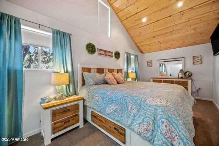 3355 Little Pine Drive Overgaard, AZ 85933 - Photo 18 of 26 a bedroom with a bed and a dresser