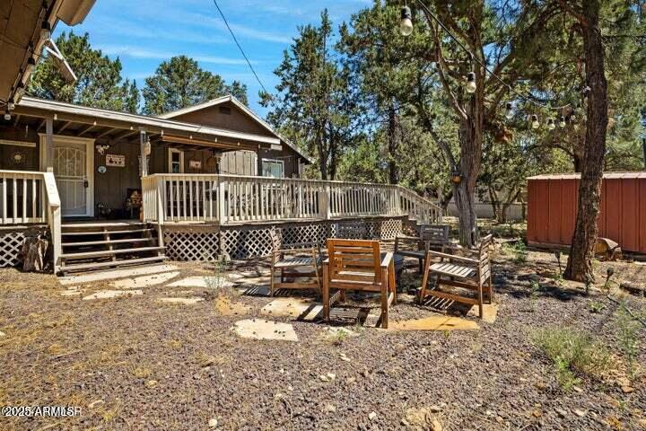 3355 Little Pine Drive Overgaard, AZ 85933 - Photo 5 of 26 a view of a house with backyard and sitting area