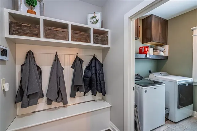 a view of walk in closet with clothes