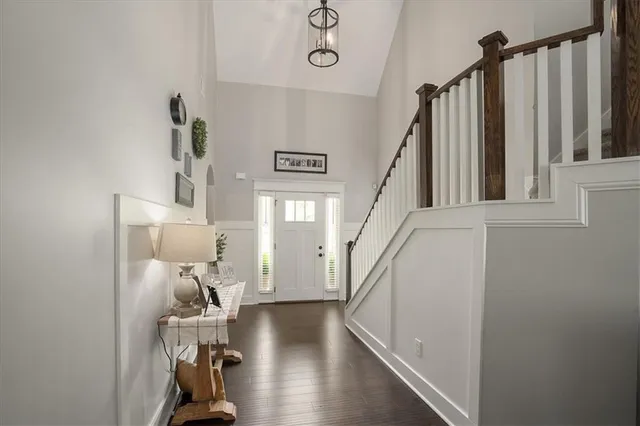 a view of a livingroom with furniture and hardwood floor