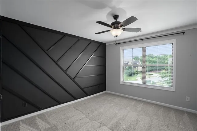 a bedroom with a bed gym equipment and a chandelier