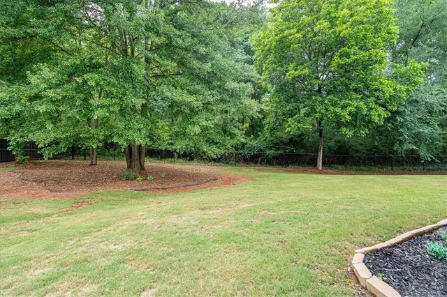 an aerial view of a house with a garden
