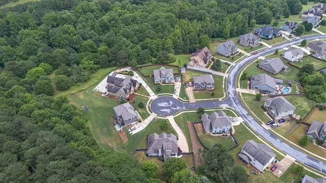 an aerial view of a house with outdoor space