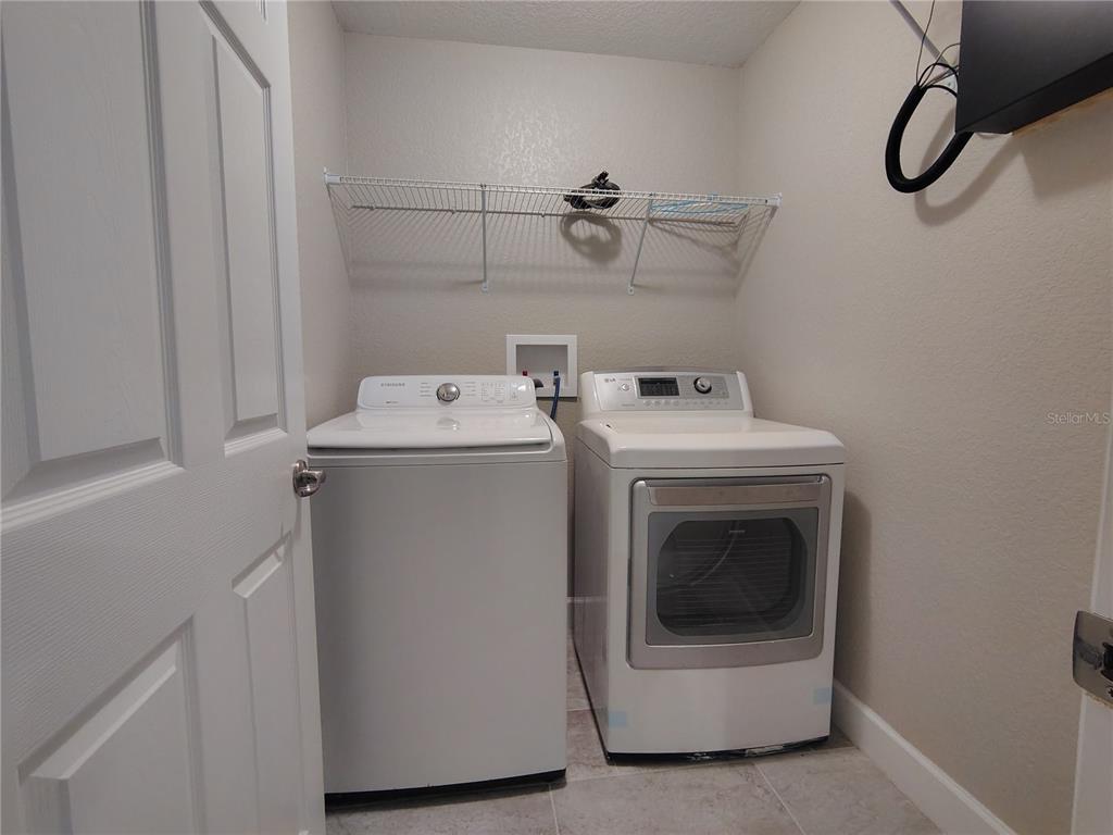 13093 Southwest 35th Circle Ocala, FL 34473 - Photo 11 of 15 a utility room with dryer and washer