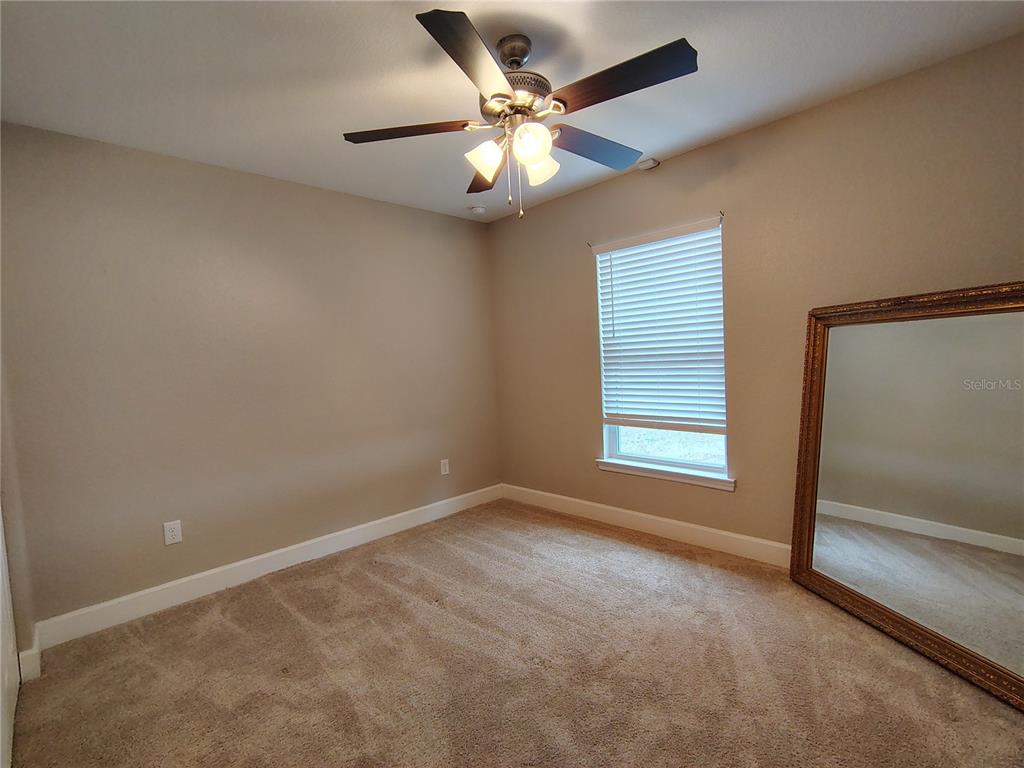 13093 Southwest 35th Circle Ocala, FL 34473 - Photo 10 of 15 a view of an empty room with a window