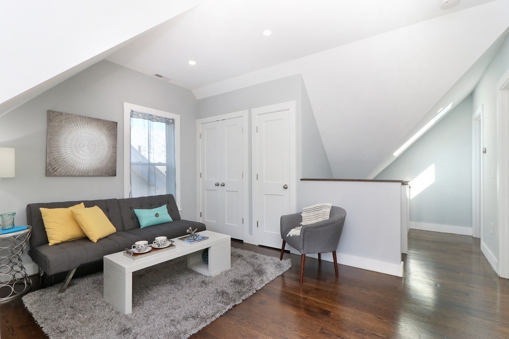 59 Mozart Street, Unit 2 Boston, MA 02130 - Photo 11 of 21 a living room with furniture and a potted plant