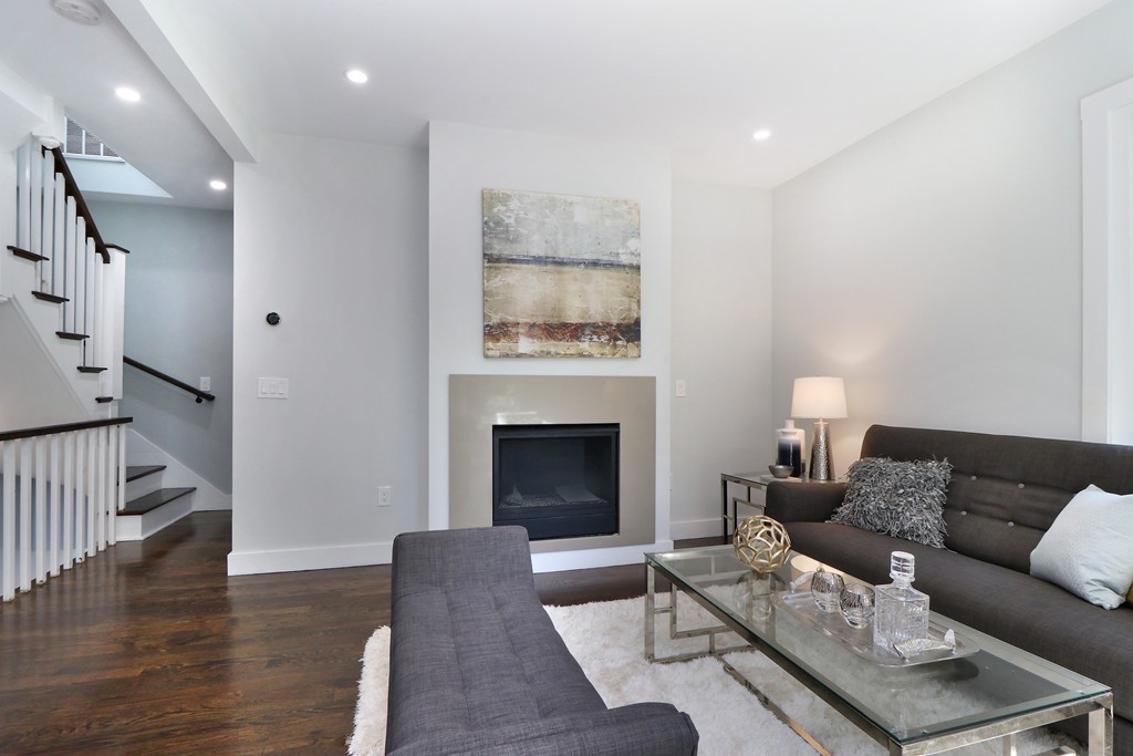 59 Mozart Street, Unit 2 Boston, MA 02130 - Photo 12 of 21 a living room with furniture and a fireplace