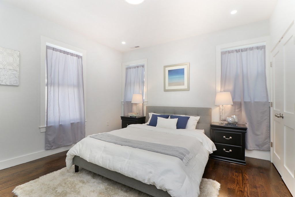 59 Mozart Street, Unit 2 Boston, MA 02130 - Photo 15 of 21 a bedroom with a bed and a window