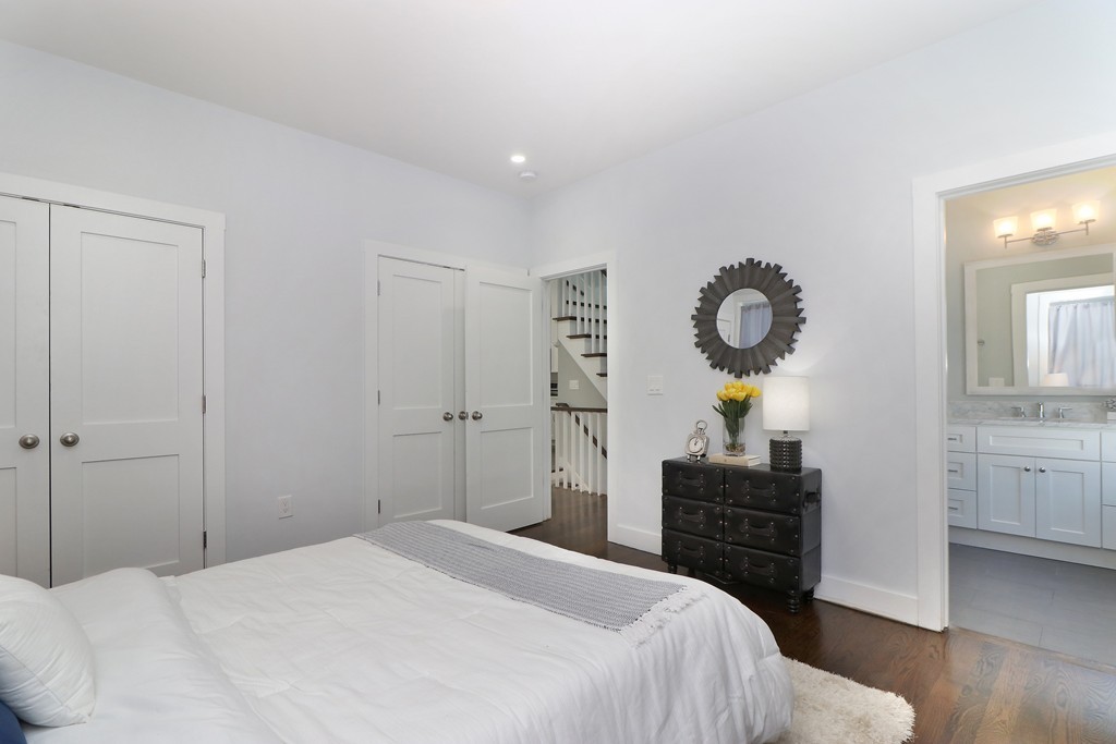 59 Mozart Street, Unit 2 Boston, MA 02130 - Photo 16 of 21 a bedroom with a bed and cabinets