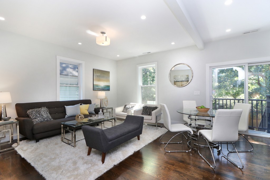 59 Mozart Street, Unit 2 Boston, MA 02130 - Photo 19 of 21 a living room with furniture and a large window