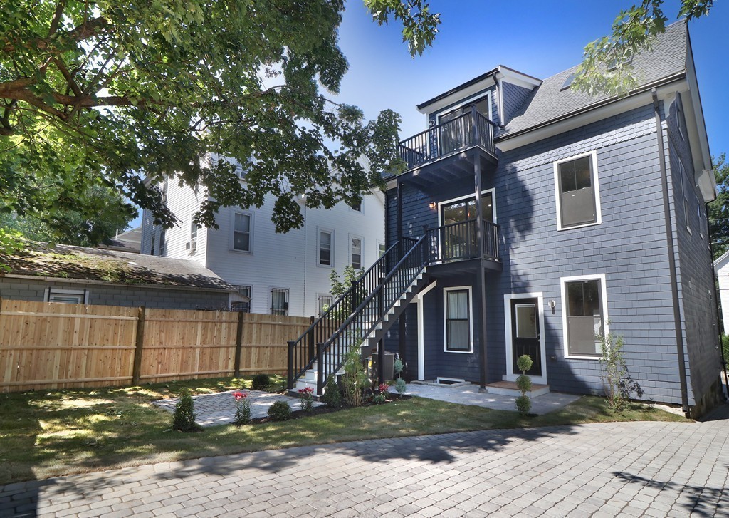 59 Mozart Street, Unit 2 Boston, MA 02130 - Photo 4 of 21 a front view of a house with garden