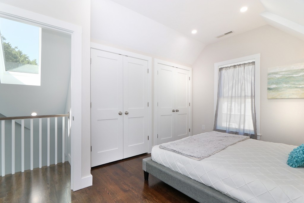 59 Mozart Street, Unit 2 Boston, MA 02130 - Photo 7 of 21 a bedroom with a bed and a window